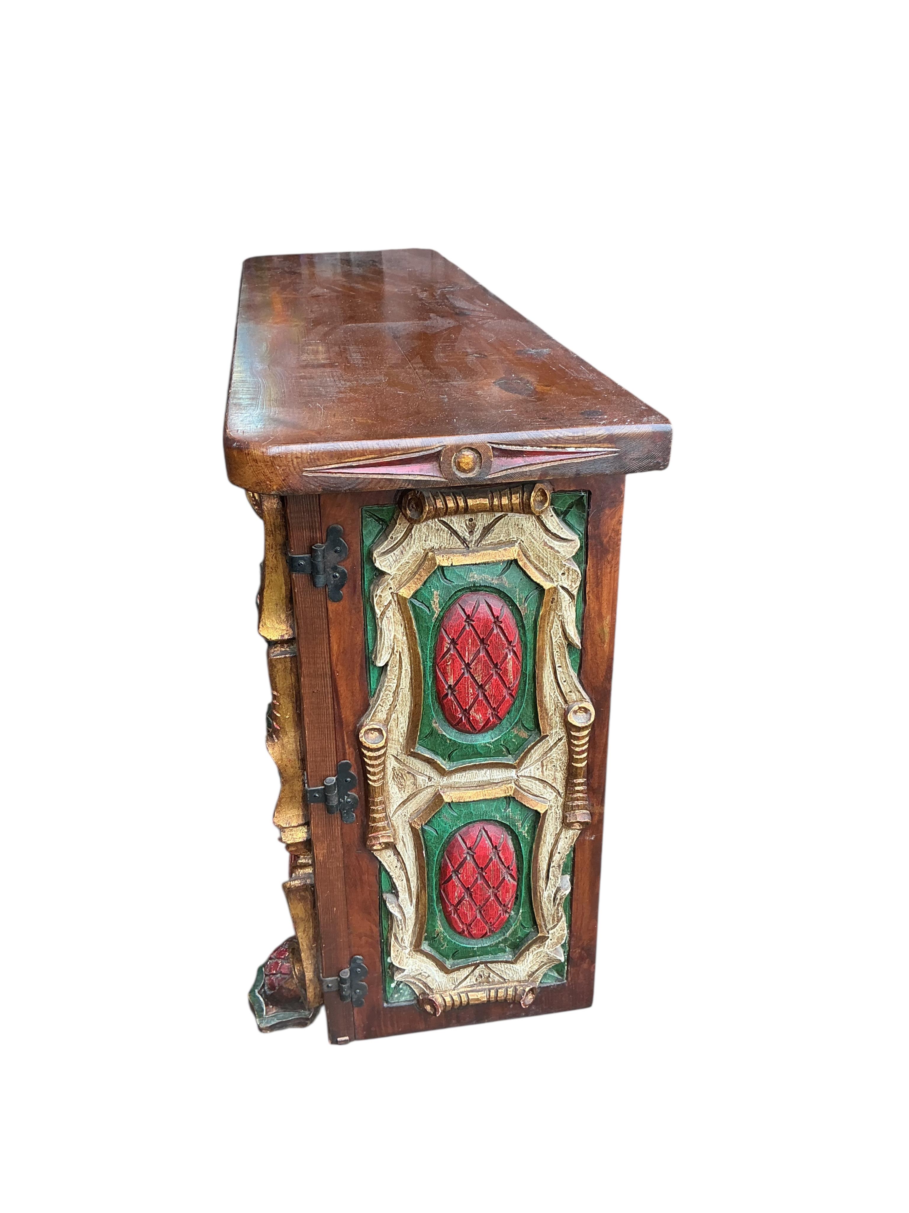 An Italian carved painted pine side cabinet, width 119cm, depth 34cm, height 79cm